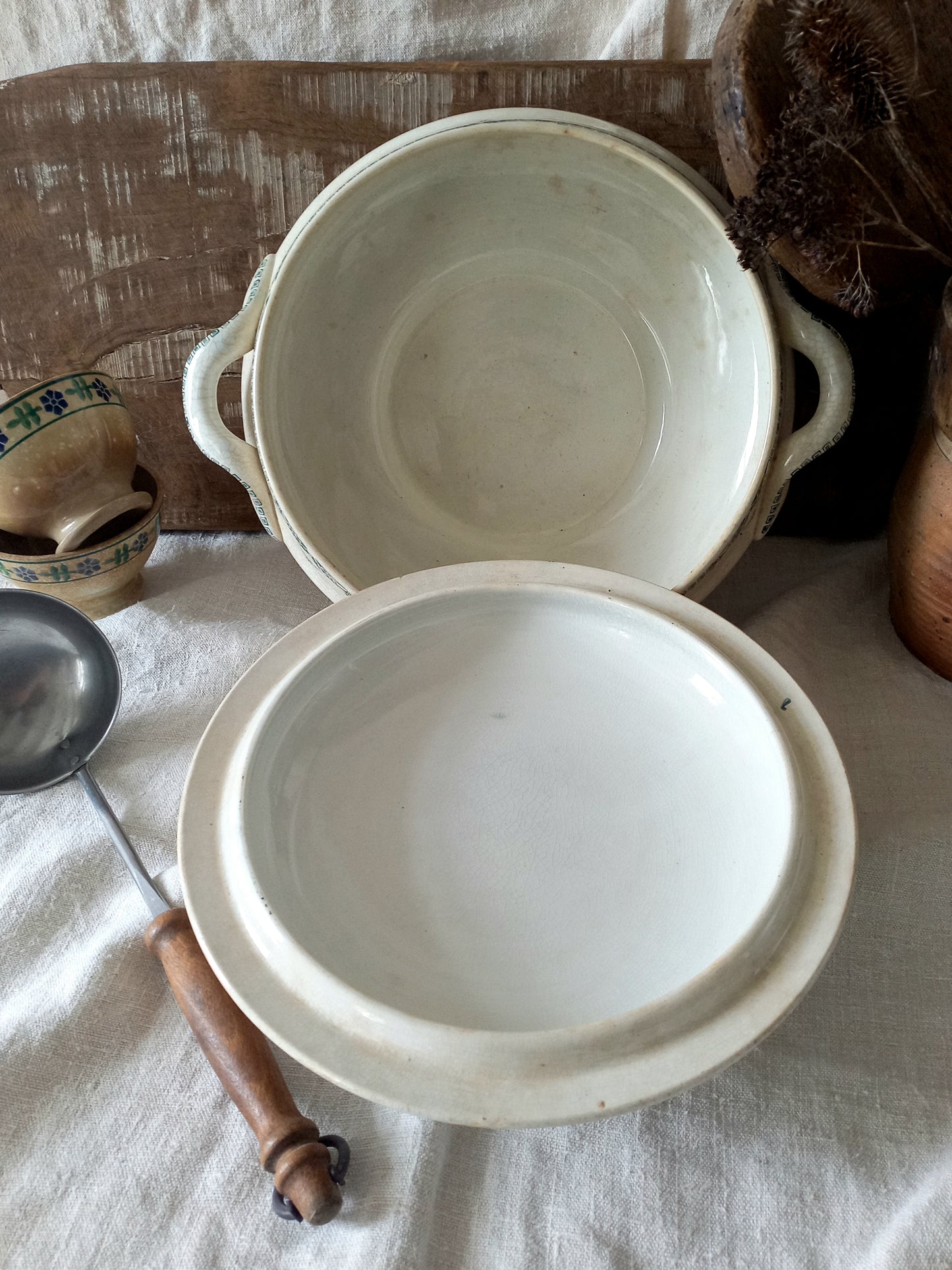 A large French antique white ironstone soup tureen with an attractive teal colour transferware design. Over the many decades this lovely old tureen has developed a time-worn patina with a warm, creamy white finish.