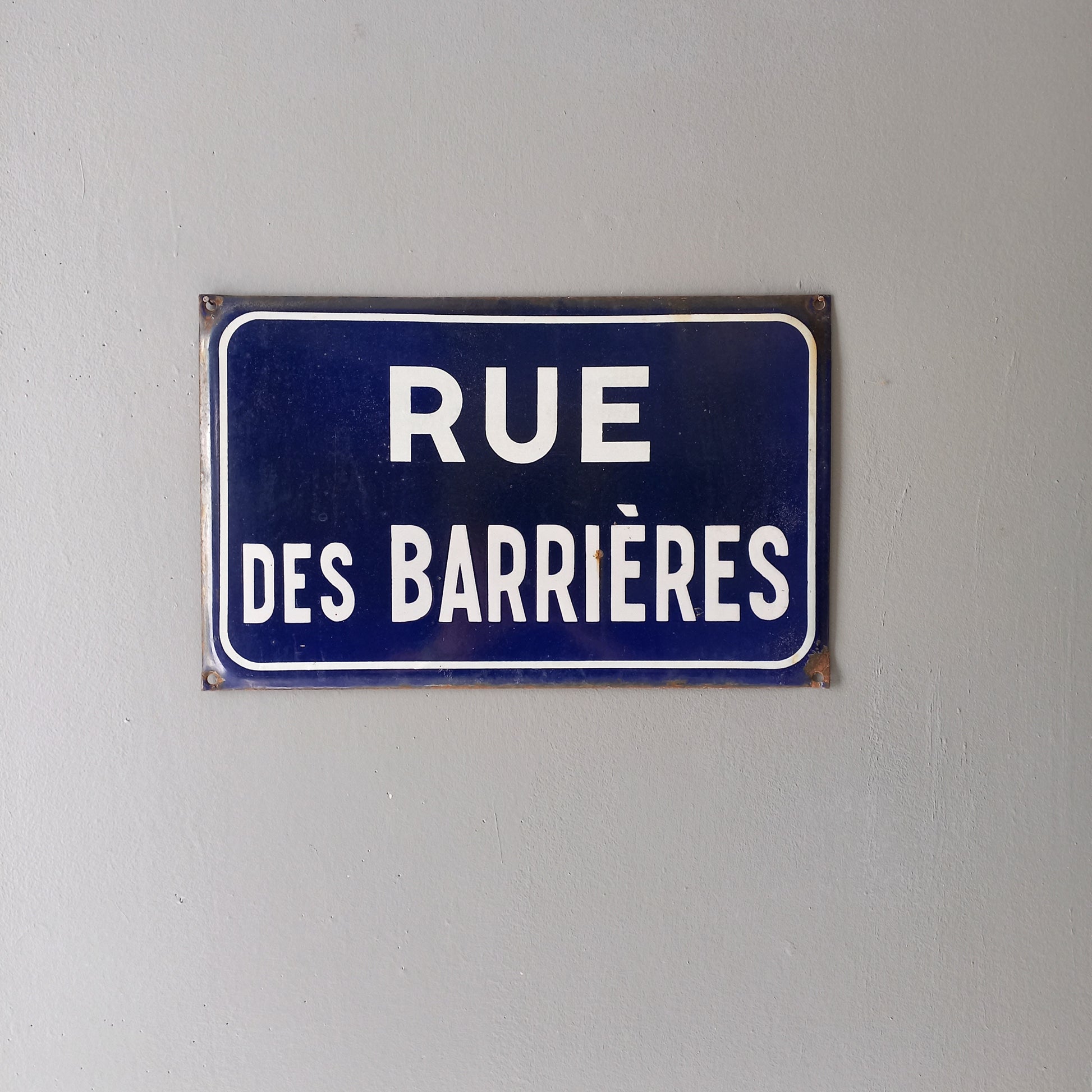 Original and very collectible, a French street name sign, 'Rue des Barrières' sauced at an antique market in south west France. These old dark blue (it's a darker blue than it appears in my photos) street signs with white text look super as pieces of home decor in French country home/shabby chic inspired interiors, man caves, commercial premises, industrial loft apartments, and many other locations.
