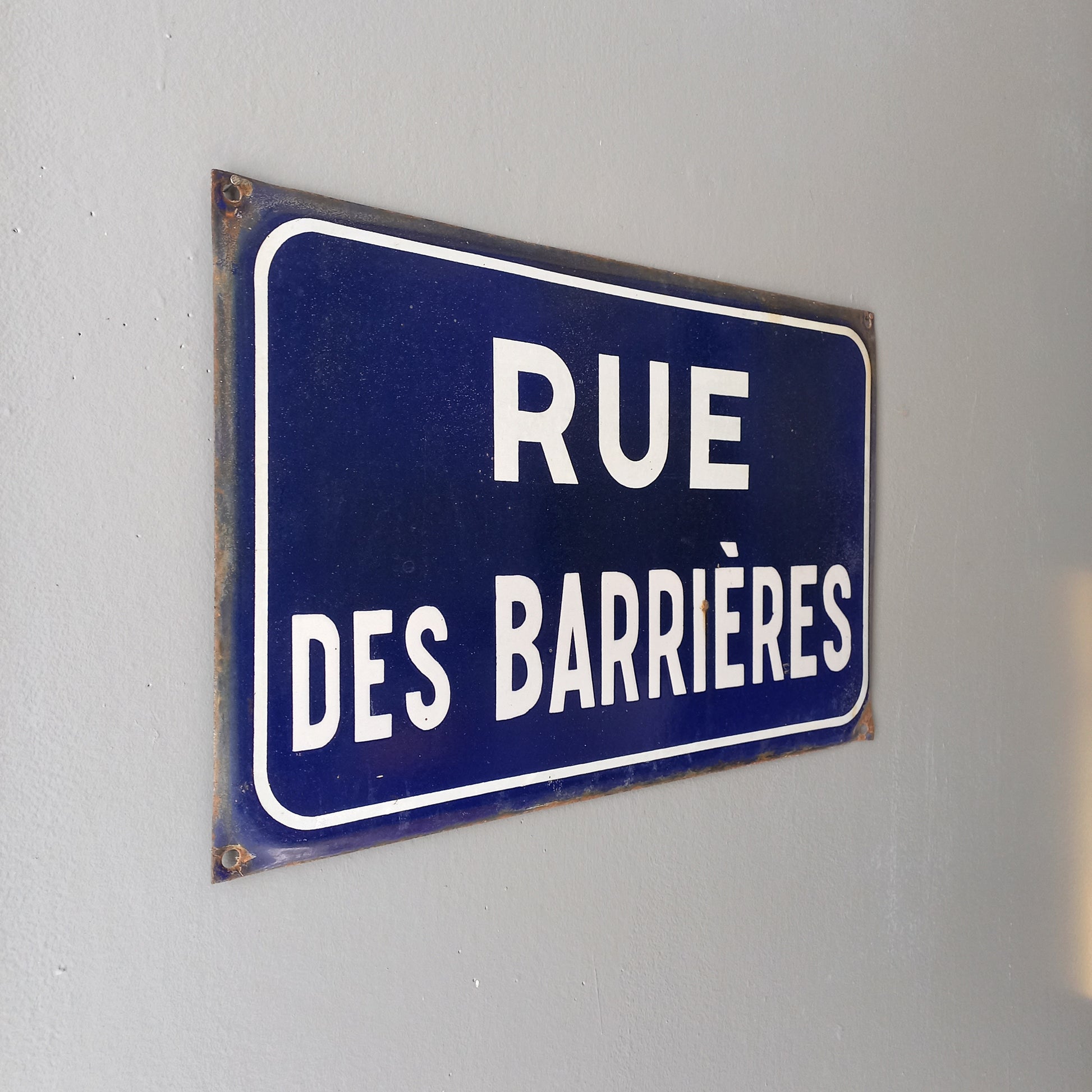 Original and very collectible, a French street name sign, 'Rue des Barrières' sauced at an antique market in south west France. These old dark blue (it's a darker blue than it appears in my photos) street signs with white text look super as pieces of home decor in French country home/shabby chic inspired interiors, man caves, commercial premises, industrial loft apartments, and many other locations.