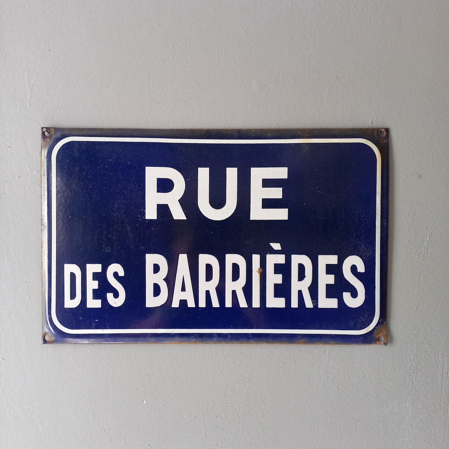 Original and very collectible, a French street name sign, 'Rue des Barrières' sauced at an antique market in south west France. These old dark blue (it's a darker blue than it appears in my photos) street signs with white text look super as pieces of home decor in French country home/shabby chic inspired interiors, man caves, commercial premises, industrial loft apartments, and many other locations.