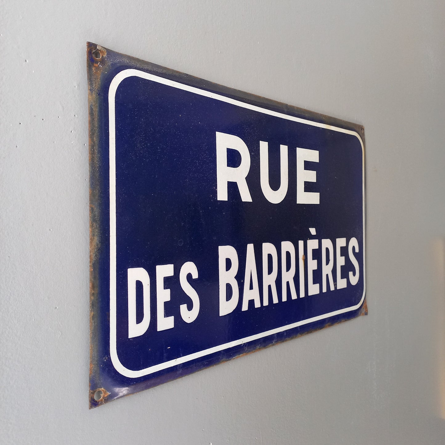 Original and very collectible, a French street name sign, 'Rue des Barrières' sauced at an antique market in south west France. These old dark blue (it's a darker blue than it appears in my photos) street signs with white text look super as pieces of home decor in French country home/shabby chic inspired interiors, man caves, commercial premises, industrial loft apartments, and many other locations.