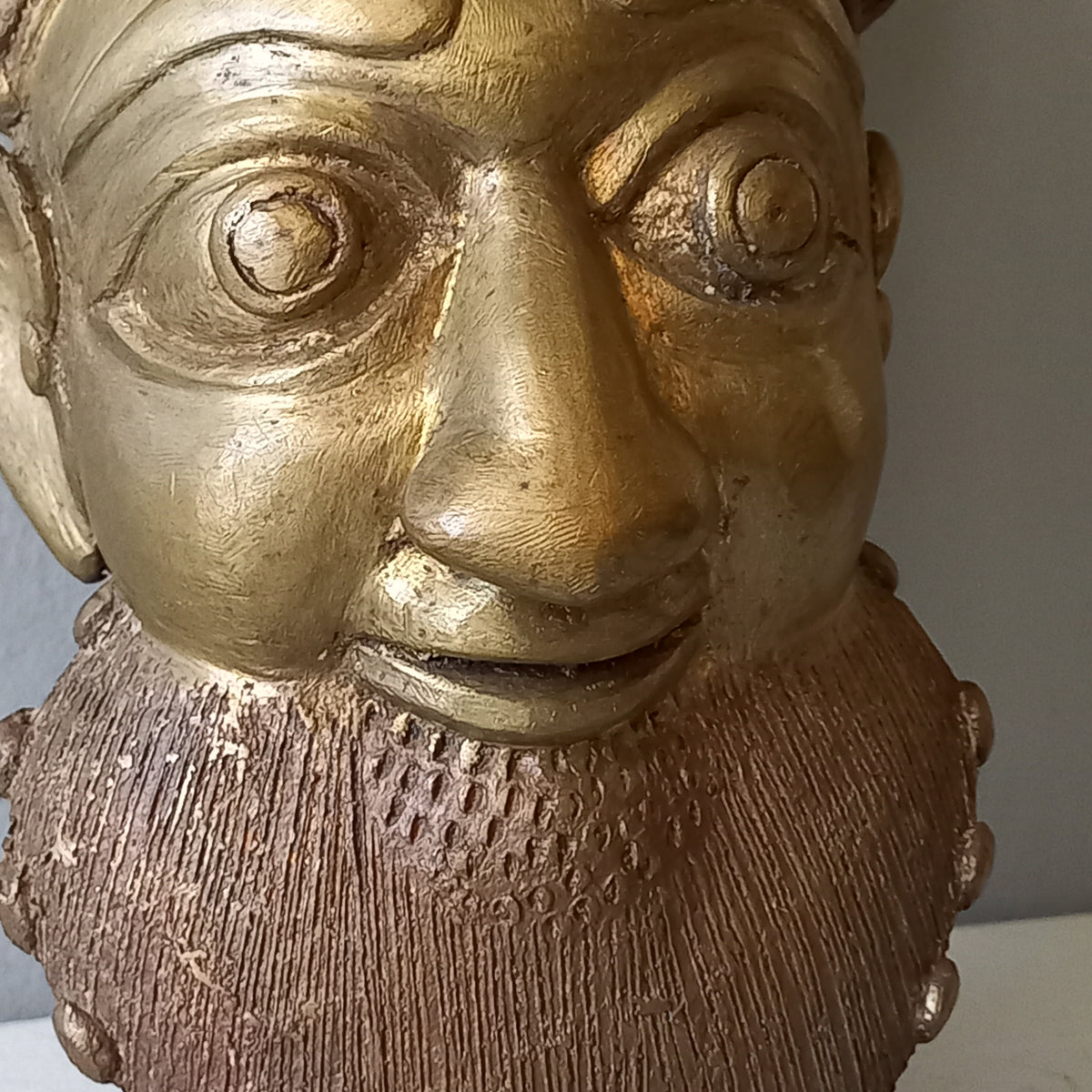 An interesting little vintage tribal mask I purchased in France. It's a heavy, quality piece made from a brass-coated metal and would look great in an ethic mask collection or as a stand alone piece of wall decor.
