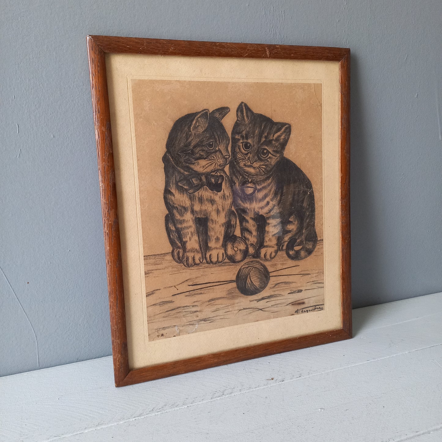 A French vintage drawing of two cute cats or kittens who look like they're planning to be naughty with their owner's ball of wool, a naive piece of art although none-the-less very charming indeed. It appears to be an original drawing, although I haven't opened up the back as it's well sealed with the original French framer's label. The drawing has been signed by the artist.