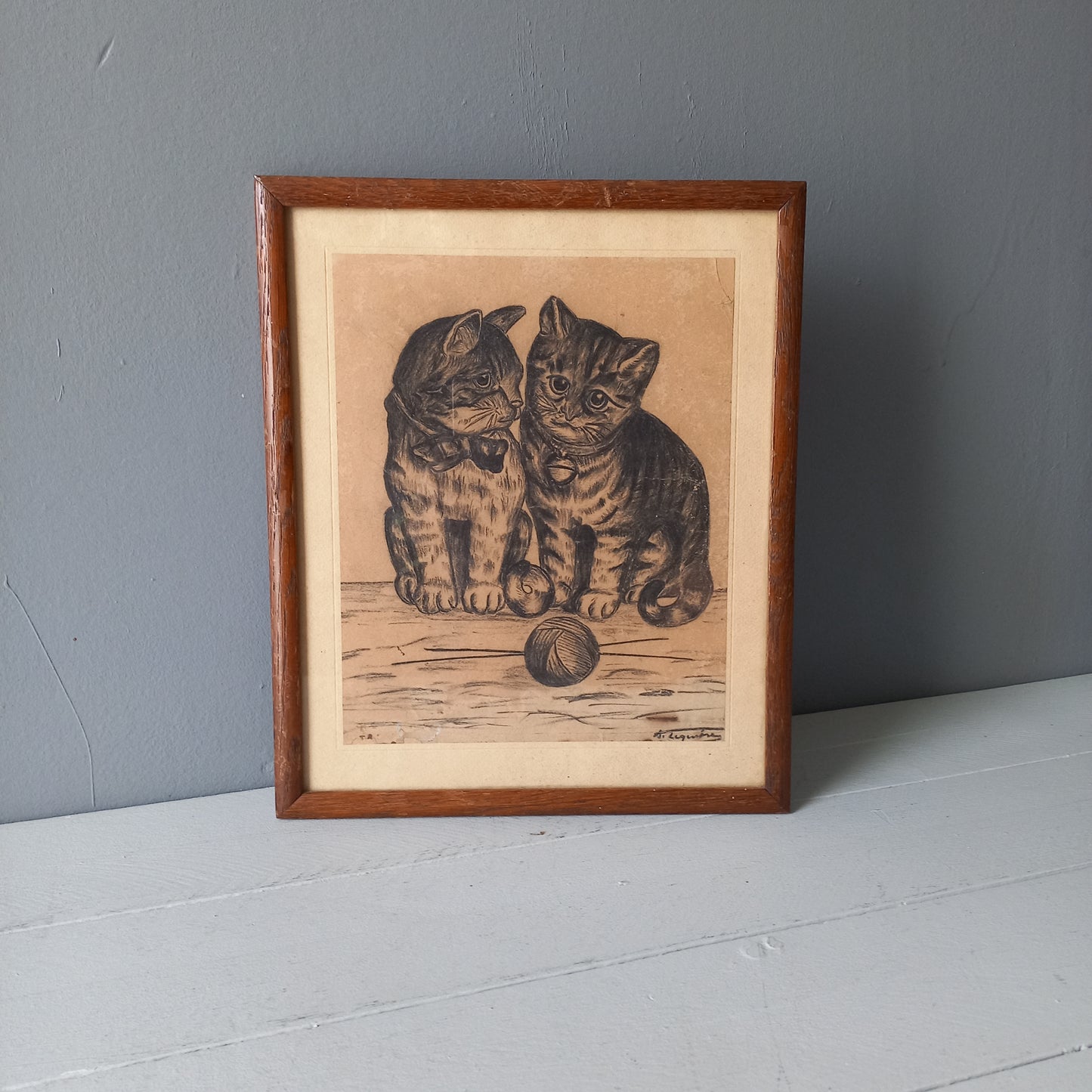 A French vintage drawing of two cute cats or kittens who look like they're planning to be naughty with their owner's ball of wool, a naive piece of art although none-the-less very charming indeed. It appears to be an original drawing, although I haven't opened up the back as it's well sealed with the original French framer's label. The drawing has been signed by the artist.