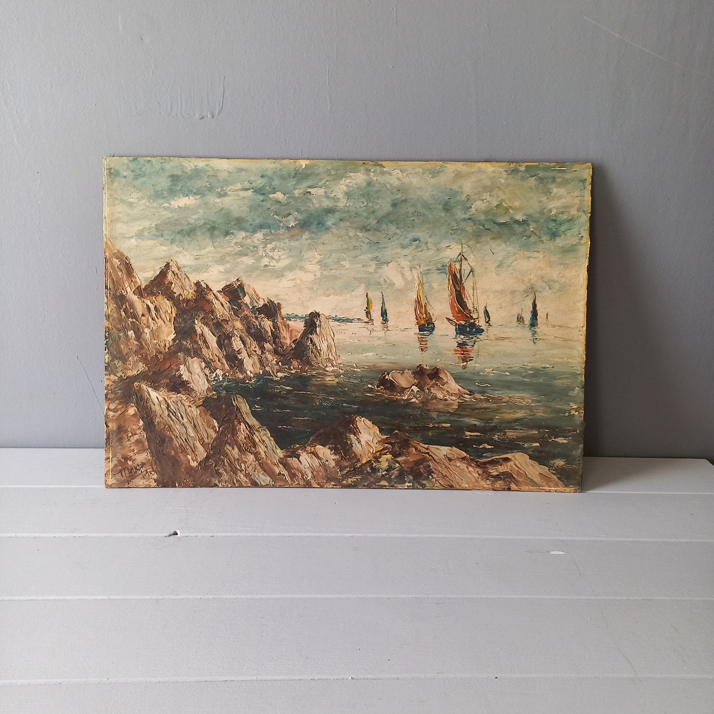 A beautiful piece of original French art depicting sailing boats on a rocky coastline. The painting is wonderfully done in a 'painterly' fashion with thick, vibrant oil paint strokes on hardboard. It has been signed and dated by the artist.