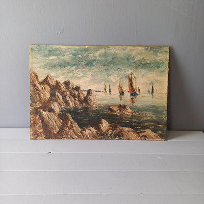 A beautiful piece of original French art depicting sailing boats on a rocky coastline. The painting is wonderfully done in a 'painterly' fashion with thick, vibrant oil paint strokes on hardboard. It has been signed and dated by the artist.