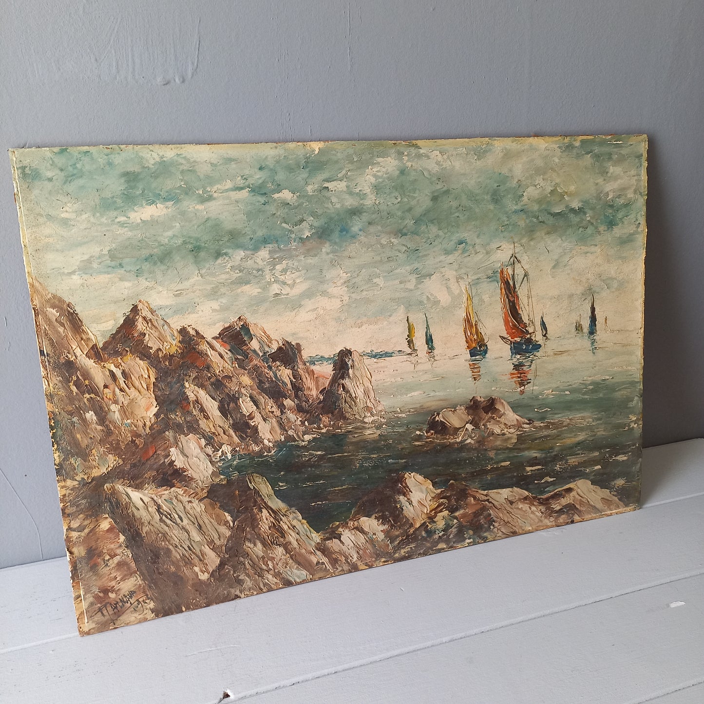 A beautiful piece of original French art depicting sailing boats on a rocky coastline. The painting is wonderfully done in a 'painterly' fashion with thick, vibrant oil paint strokes on hardboard. It has been signed and dated by the artist.