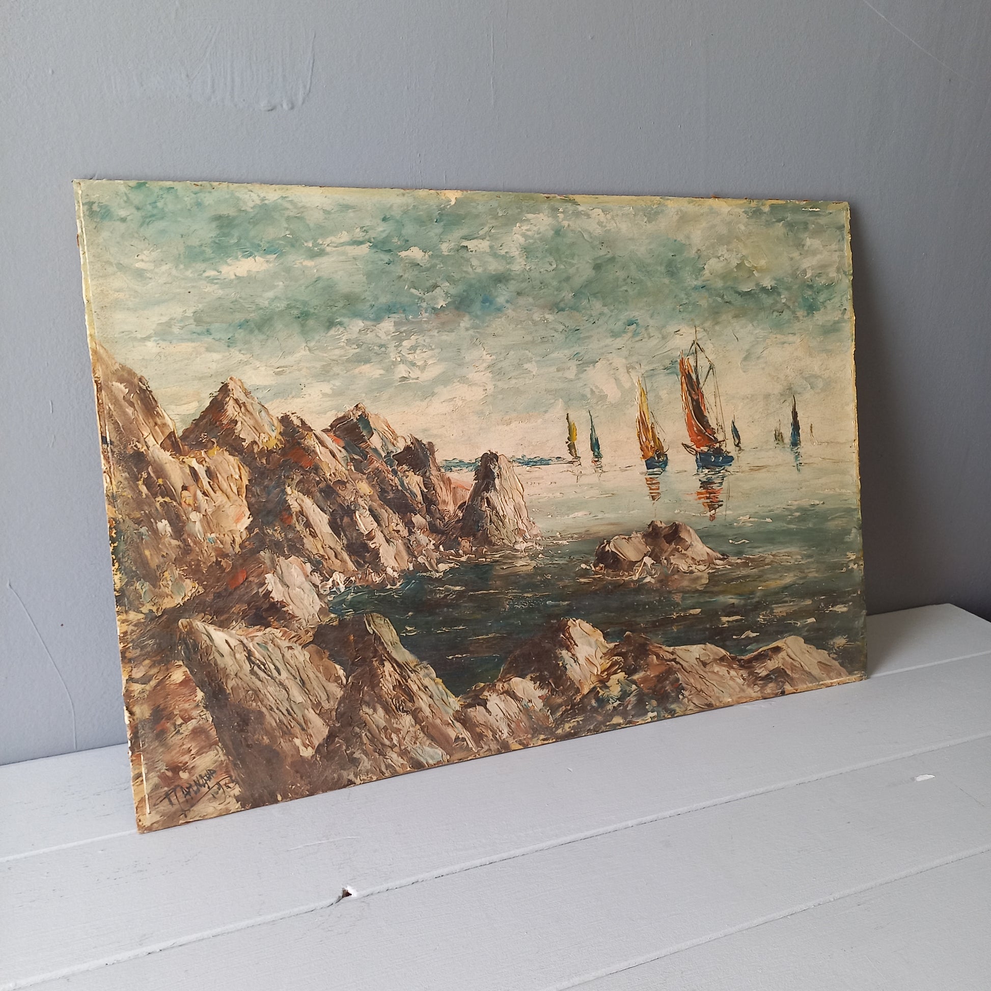 A beautiful piece of original French art depicting sailing boats on a rocky coastline. The painting is wonderfully done in a 'painterly' fashion with thick, vibrant oil paint strokes on hardboard. It has been signed and dated by the artist.