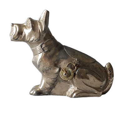 A fabulous French art deco metal terrier dog money box/coin storage box complete with a little padlock and key which still work. 

This unique piece of history was purchased in south west France and we can only imagine who once owned it and what they might have saved their coins to buy.