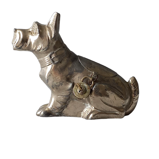 A fabulous French art deco metal terrier dog money box/coin storage box complete with a little padlock and key which still work. 

This unique piece of history was purchased in south west France and we can only imagine who once owned it and what they might have saved their coins to buy.