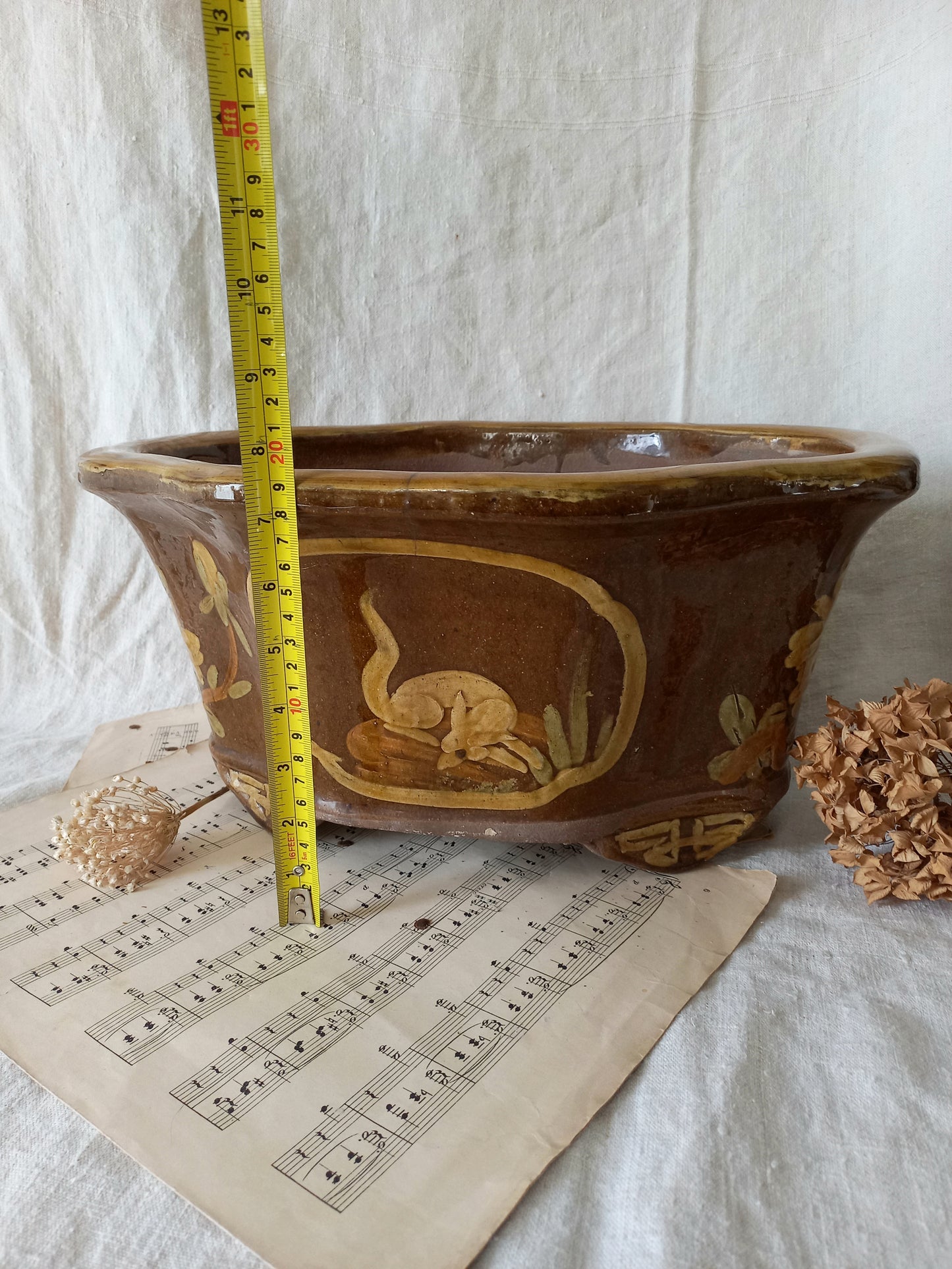 A stunning decorative glazed stoneware planter with oriental animal and floral design influences. 