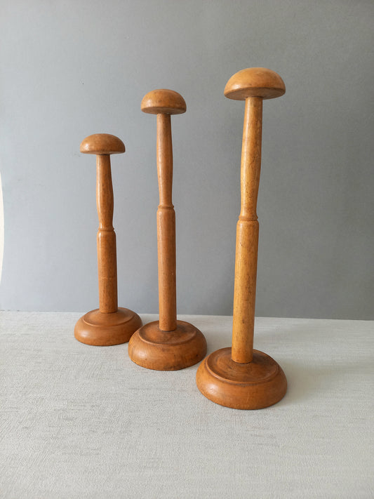 Three vintage wooden hat stands