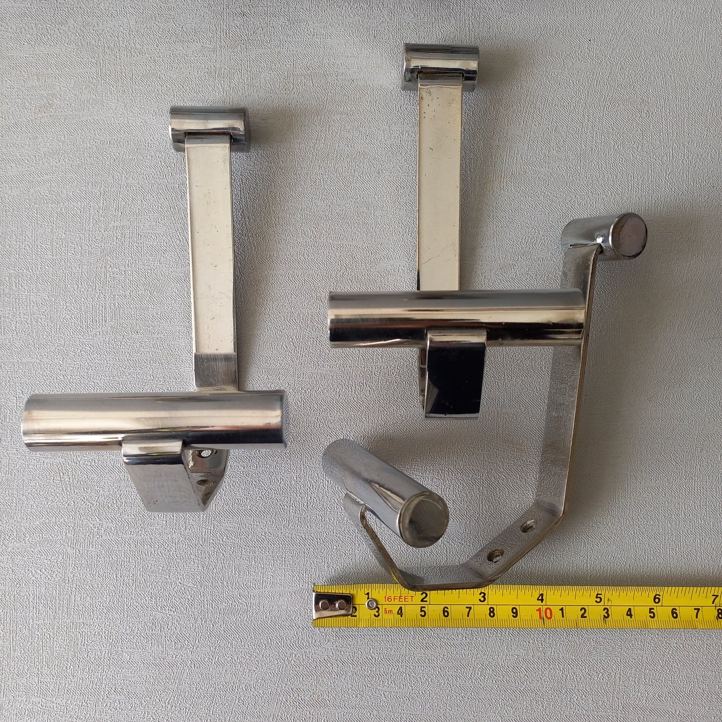 Set of 6 French vintage mid-century coat and hat hooks made from polished metal that can be simply fitted to your wall using the mounting holes.