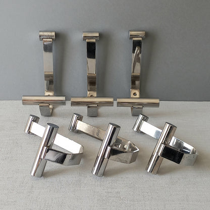 Set of 6 French vintage mid-century coat and hat hooks made from polished metal that can be simply fitted to your wall using the mounting holes.