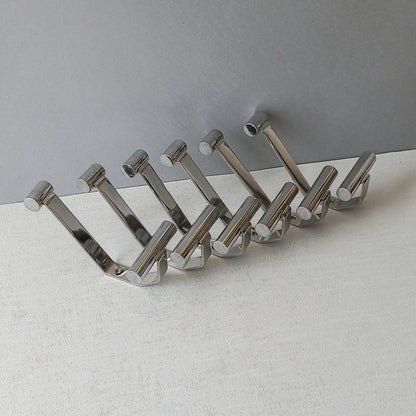 Set of 6 French vintage mid-century coat and hat hooks made from polished metal that can be simply fitted to your wall using the mounting holes.