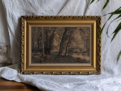 Framed artwork of a landscape with trees on a white fabric background