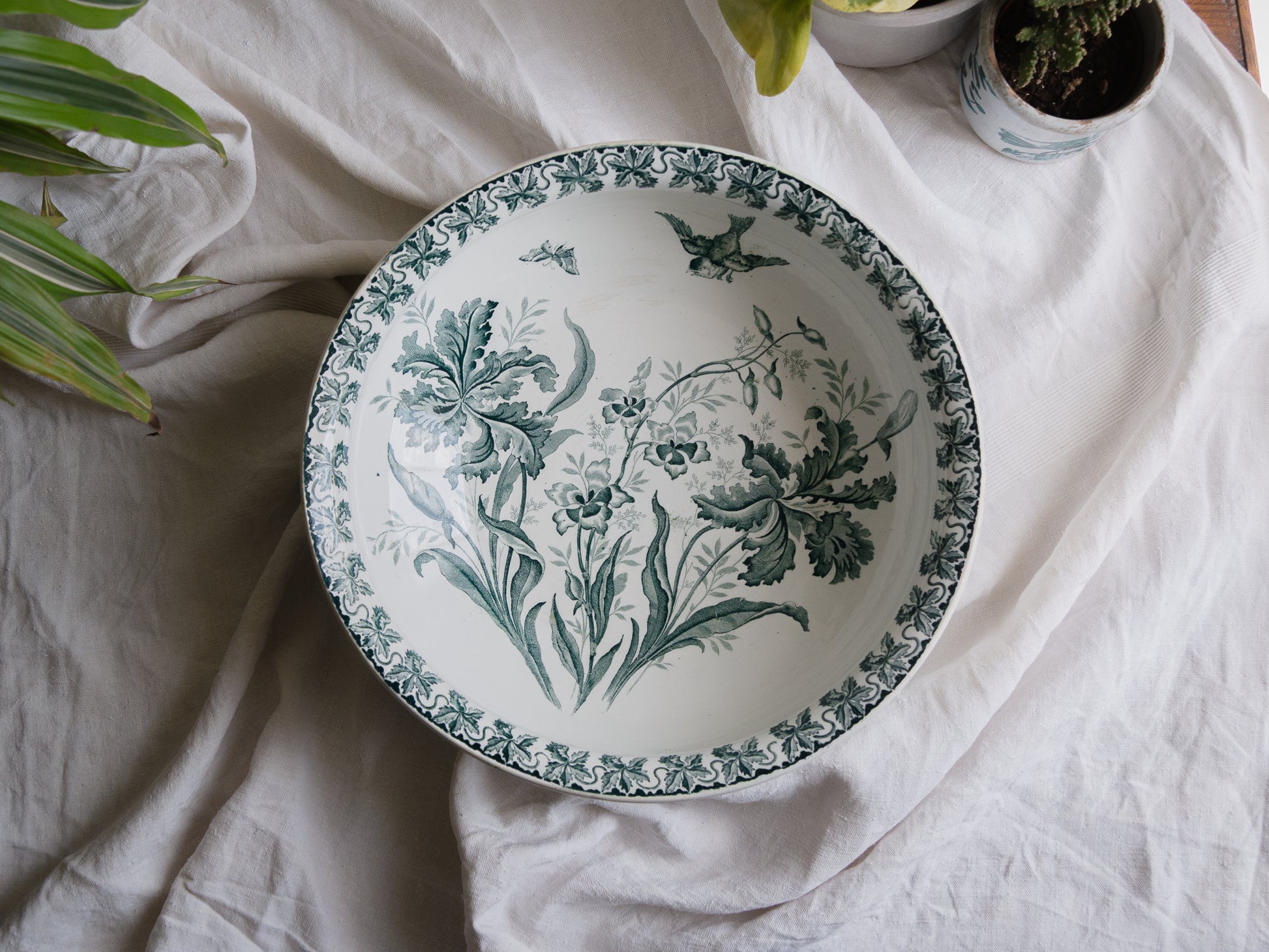 A French antique ironstone jug, basin and soap dish, printed in a soft teal-green bird-and-floral pattern. 