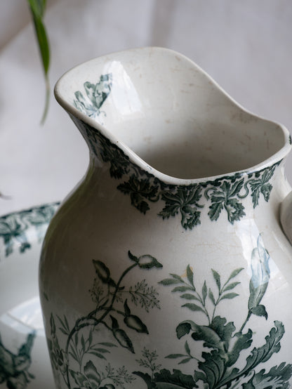 A French antique ironstone jug, basin and soap dish, printed in a soft teal-green bird-and-floral pattern. 