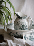 A French antique ironstone jug, basin and soap dish, printed in a soft teal-green bird-and-floral pattern. 