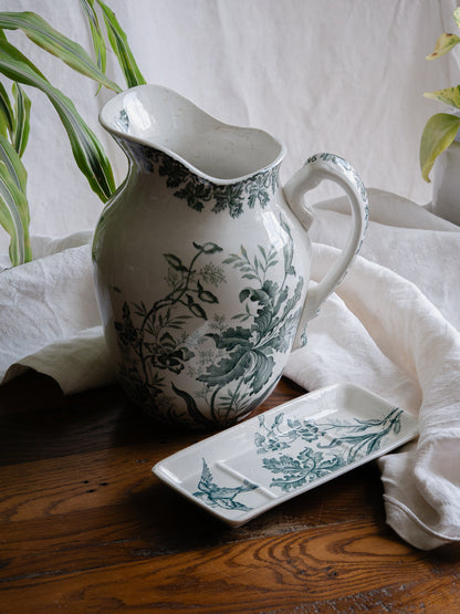 A French antique ironstone jug, basin and soap dish, printed in a soft teal-green bird-and-floral pattern. 