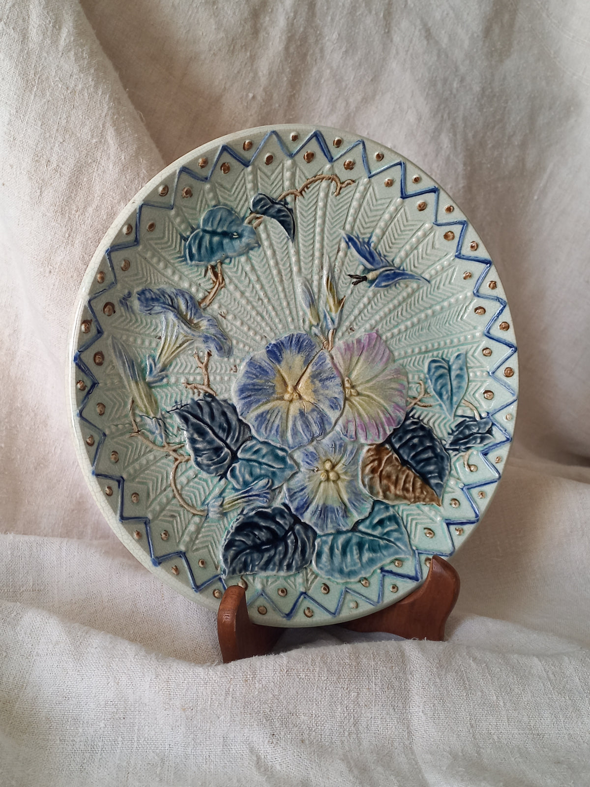 Antique Wasmuel blue floral majolica plate with designs in relief.