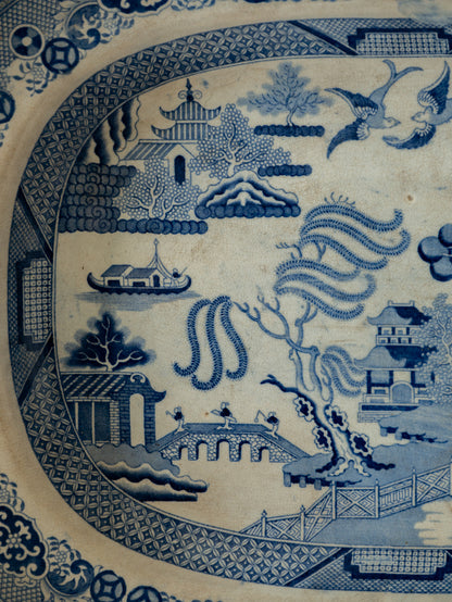 Blue and white ceramic plate with scenic design