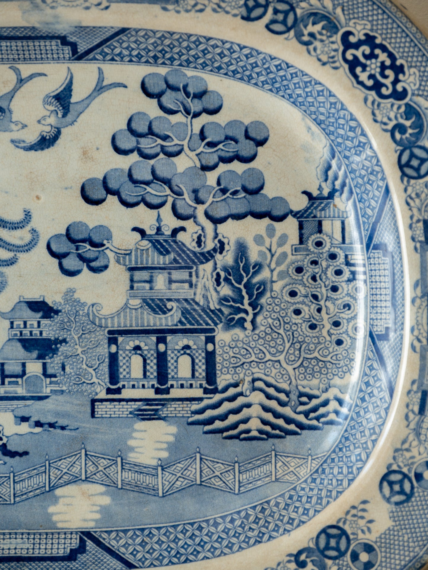 Blue and white ceramic plate with intricate landscape design