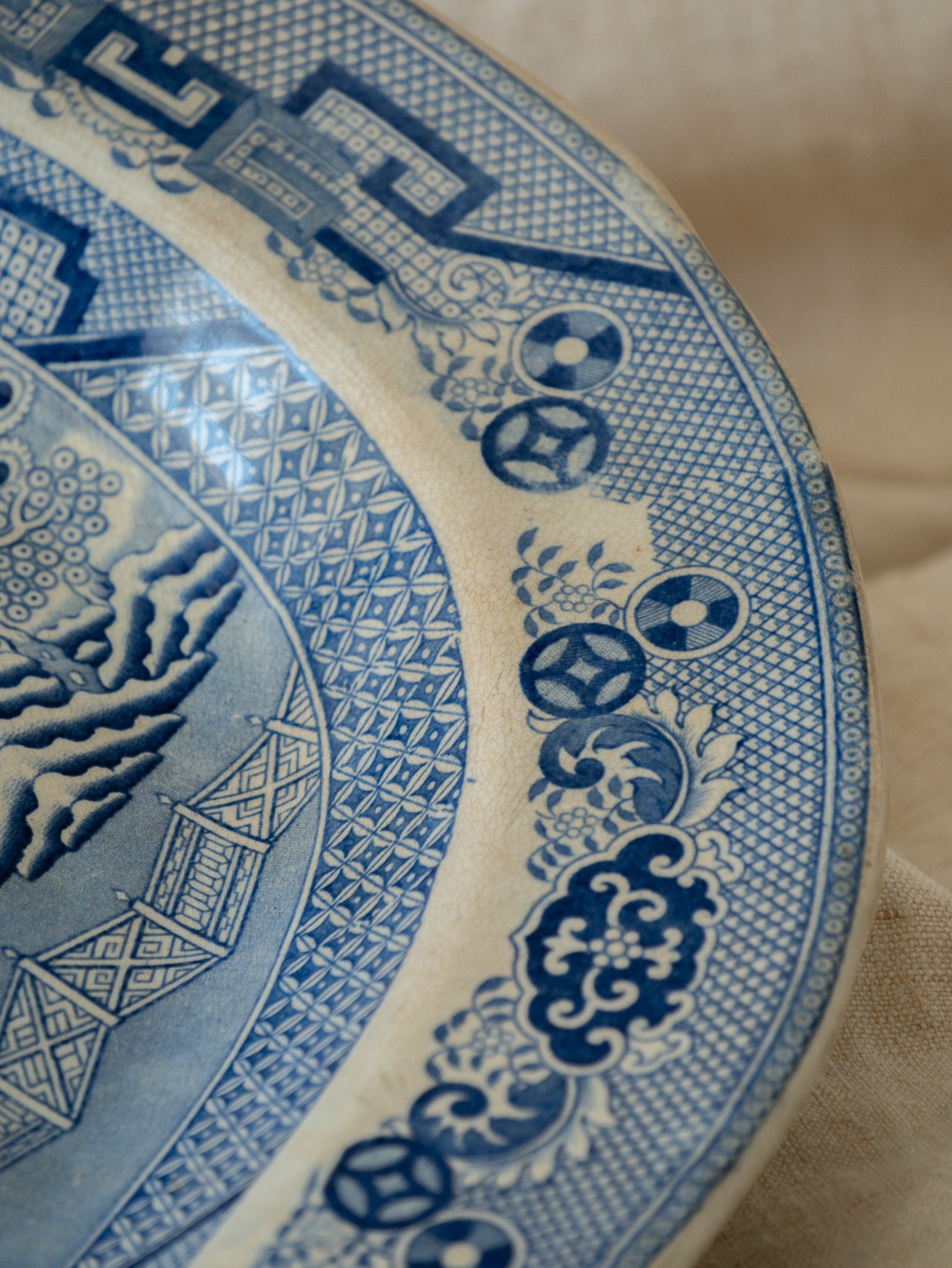 Close-up of a blue and white decorative plate with intricate patterns.