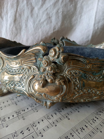 French art nouveau decorative brass planter in a decorative setting.