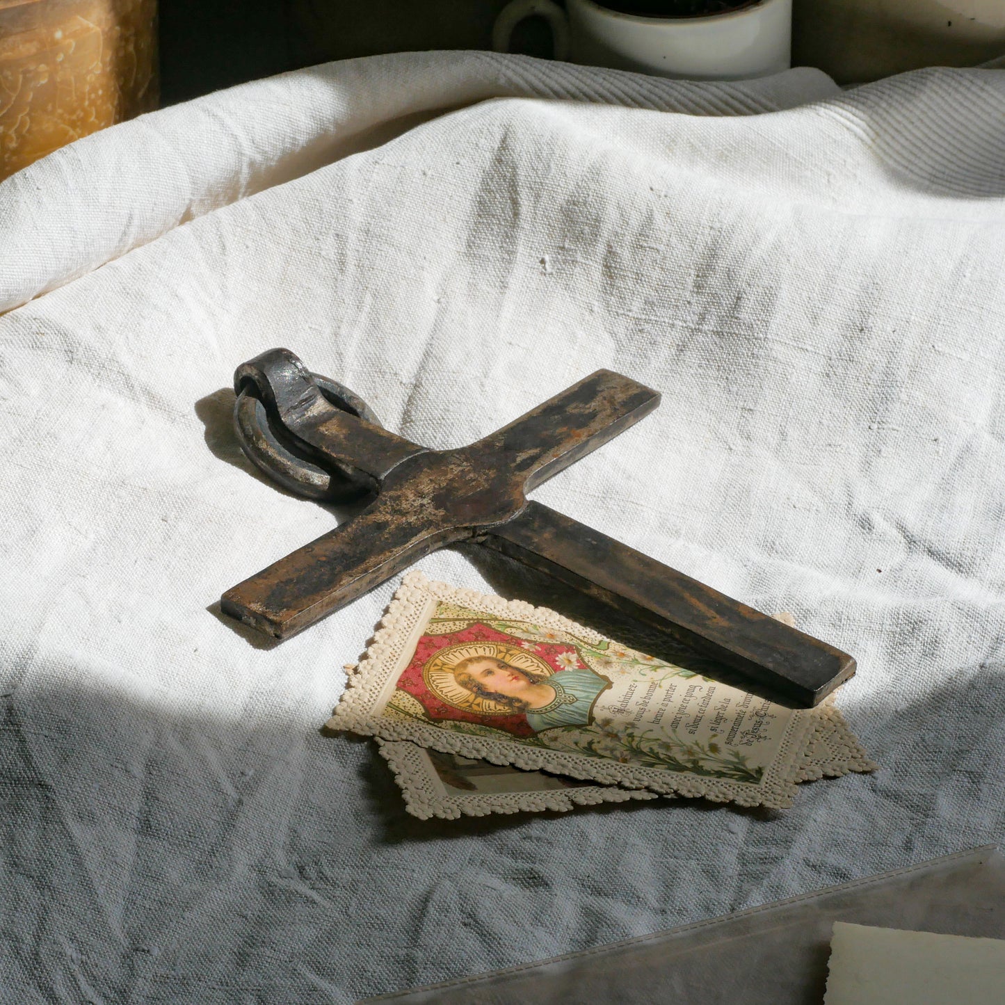 An interesting French antique artisan made Crucifix made from iron and painted black. On one side the metal has worn away in places giving this piece a pleasing patina of age. There's a hanging loop so it's ready to hang in your home.

We guesstimate this piece to be over 100 years old.