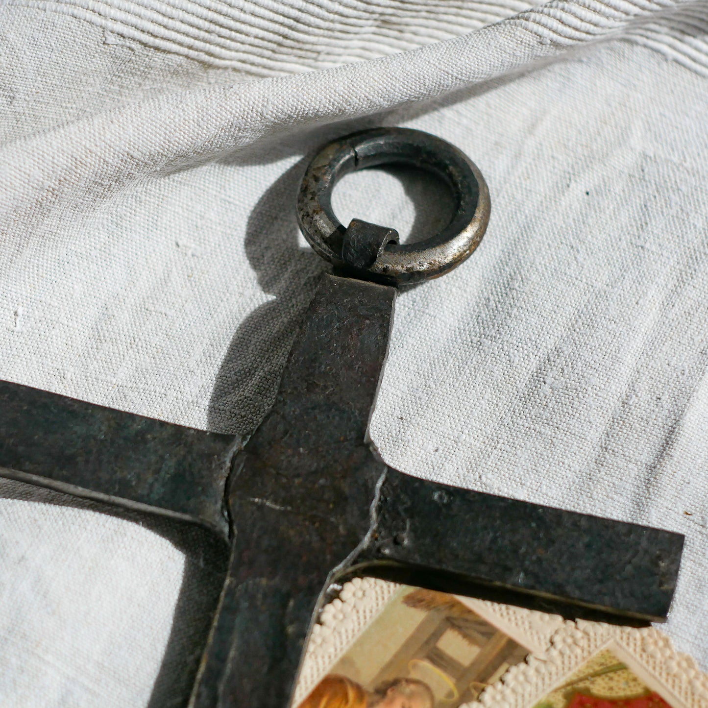 An interesting French antique artisan made Crucifix made from iron and painted black. On one side the metal has worn away in places giving this piece a pleasing patina of age. There's a hanging loop so it's ready to hang in your home.

We guesstimate this piece to be over 100 years old.