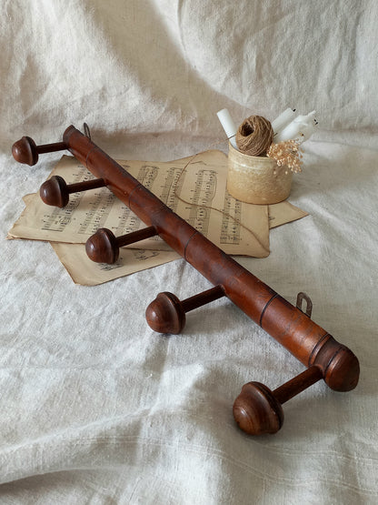 A French vintage faux bamboo wooden coat rack with 5 hanging hooks/pegs.