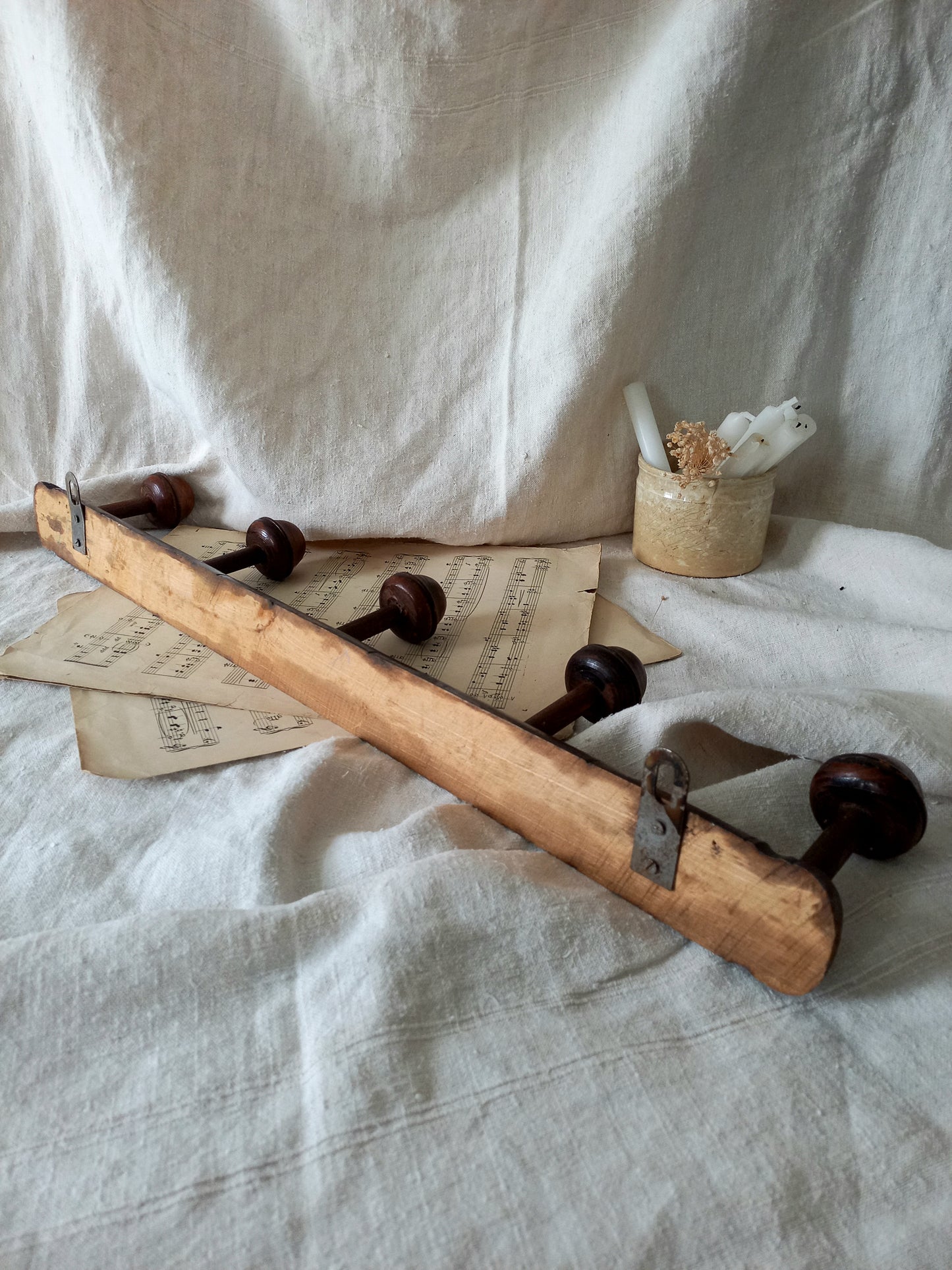 Rear of a French vintage faux bamboo wooden coat rack with 5 hanging hooks/pegs.