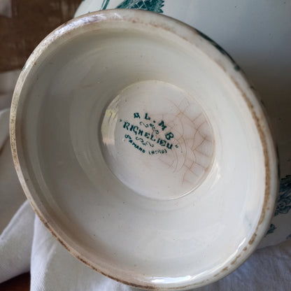 A small-sized antique ironstone soup tureen by French manufacturer, St. Amand. This tureen is adorned with a beautiful teal coloured floral transferware pattern and has a splendid little handle on the lid. In summary, an elegant piece with just enough patina of age to give it character.