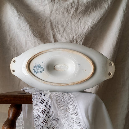 A large and elegant antique ironstone sauce boat with a green floral transferware pattern, a grand-looking, heavy piece. These days this piece will make an excellent piece of decor in any home, especially those of a country or farmhouse nature.
