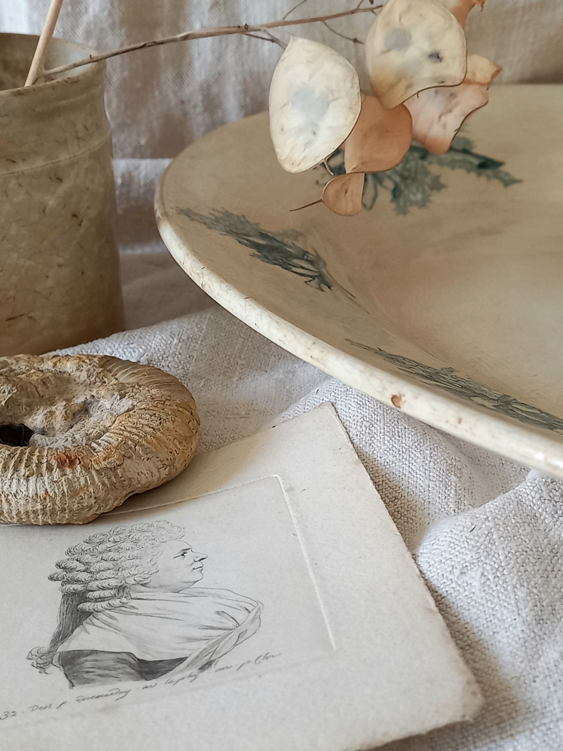 French antique oval ironstone serving plate with teal colour sunflower transferware pattern that over many decades has become a pleasing, warm shade of creamy white with crazing and tea-staining. 