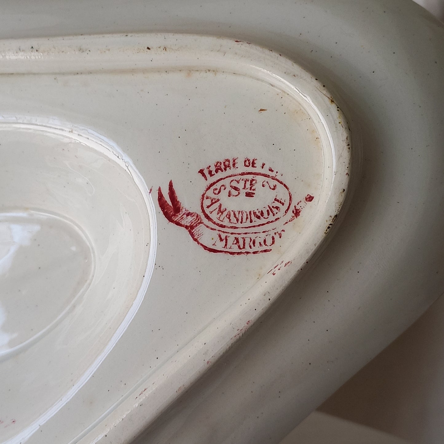 A beautiful French antique white ironstone gravy boat with a pretty pink floral transferware pattern, a heavy and quality piece manufactured by St. Amand. A great piece of decor in any home, and especially those of a rustic, country or farmhouse nature.