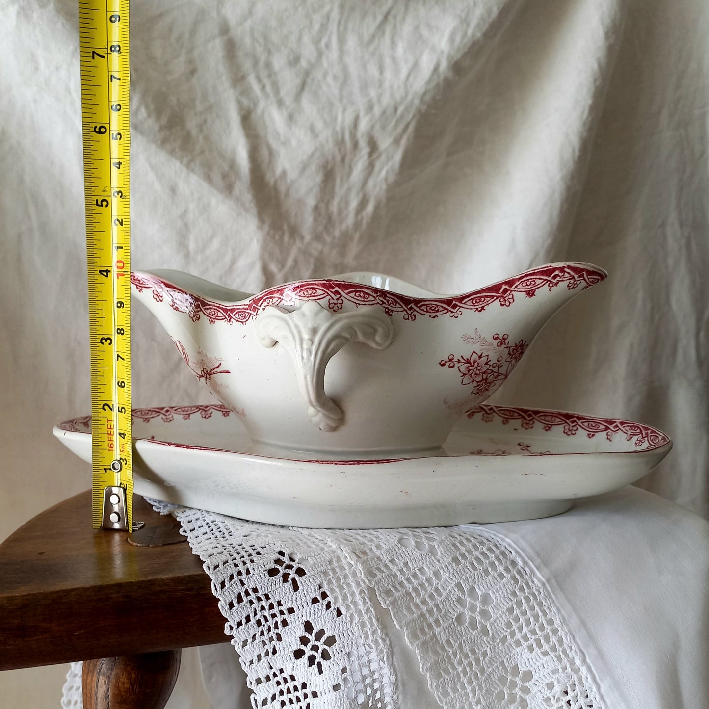 A beautiful French antique white ironstone gravy boat with a pretty pink floral transferware pattern, a heavy and quality piece manufactured by St. Amand. A great piece of decor in any home, and especially those of a rustic, country or farmhouse nature.