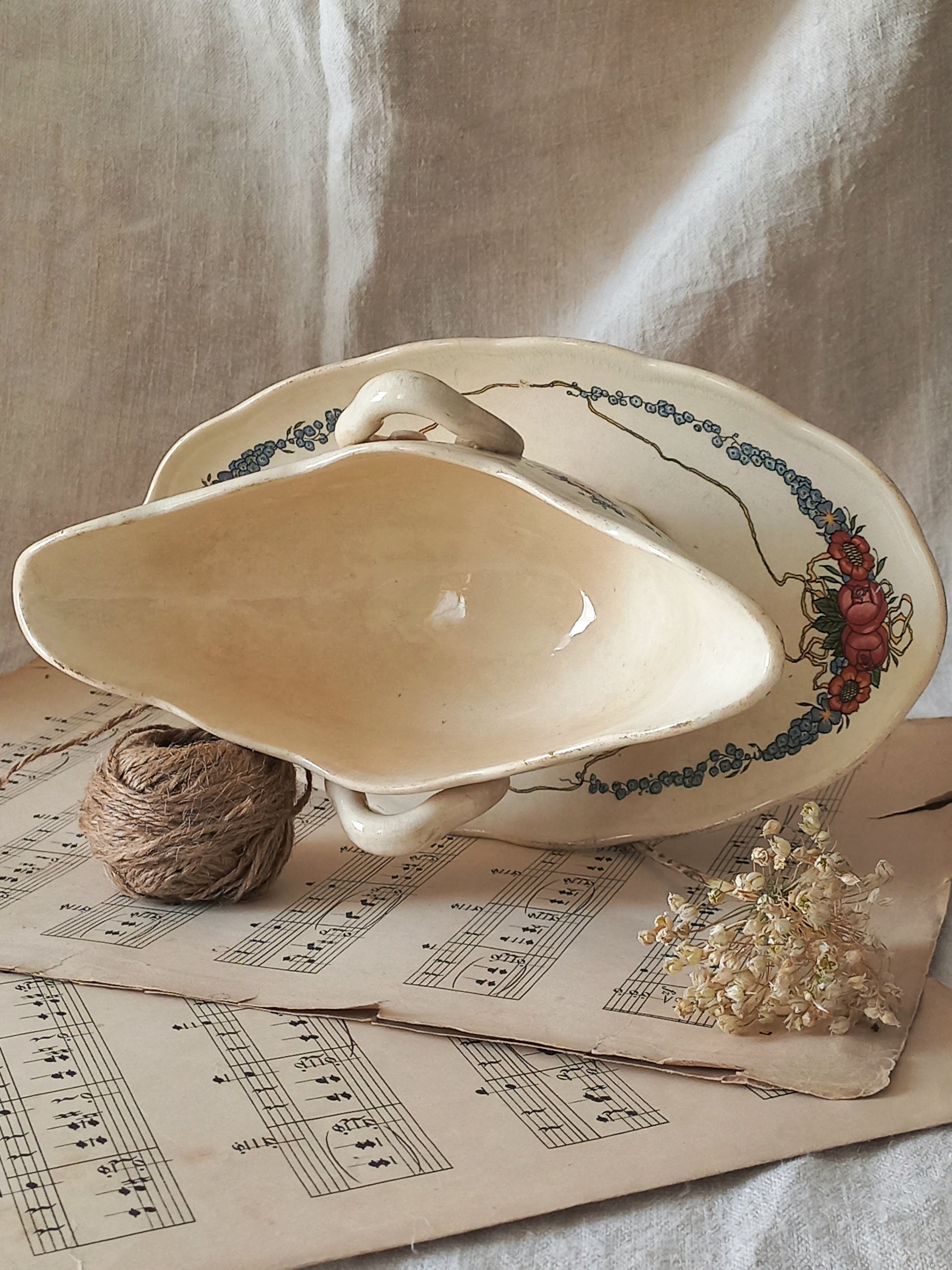 Stunning French vintage ironstone gravy boat with pretty floral patterns. This particular piece of ironstone was manufactured by premier French company, Sarreguemines. 