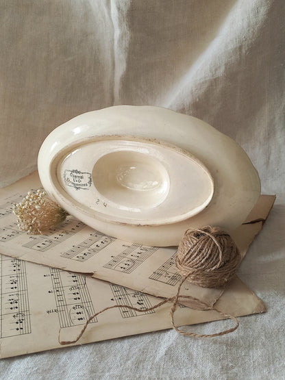 Stunning French vintage ironstone gravy boat with pretty floral patterns. This particular piece of ironstone was manufactured by premier French company, Sarreguemines. 