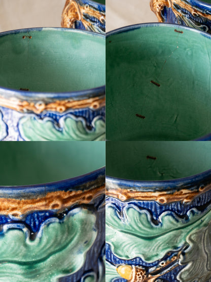 A stunning pair of French antique majolica planters, absolutely glorious fresh blue and green colours with oak leafs and acorns in relief making these stunning pieces of interior home decor wherever you decide to display them.

One of the planters has an antique repair in the form of metal staples that have been expertly done from the inside - in the 1800s and early 1900s this was quite a common repair to have made on items of high value and we feel it only adds to the authenticity/story of these pieces.