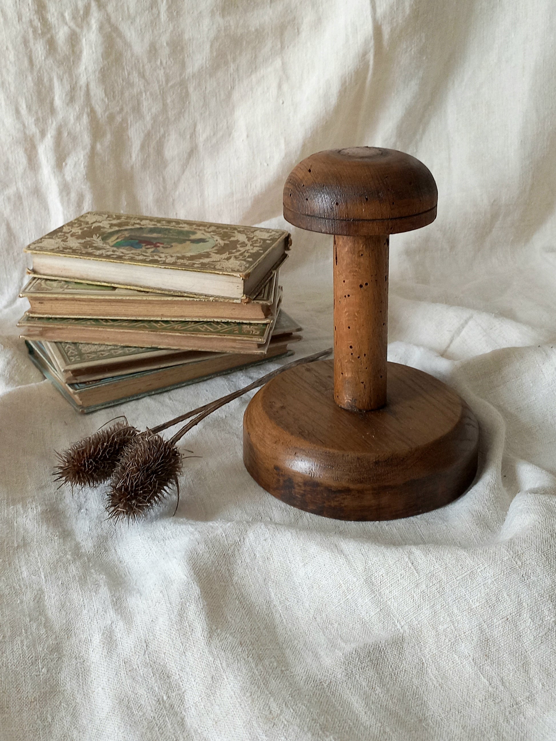 A beautiful French vintage/antique wooden hat stand/milliner's stand. This hand-made hat stand is a short, solid and sturdy piece with some good weight to it that will make a great piece of home decor in any interior, especially those inspired by rustic, country and farmhouse decor.