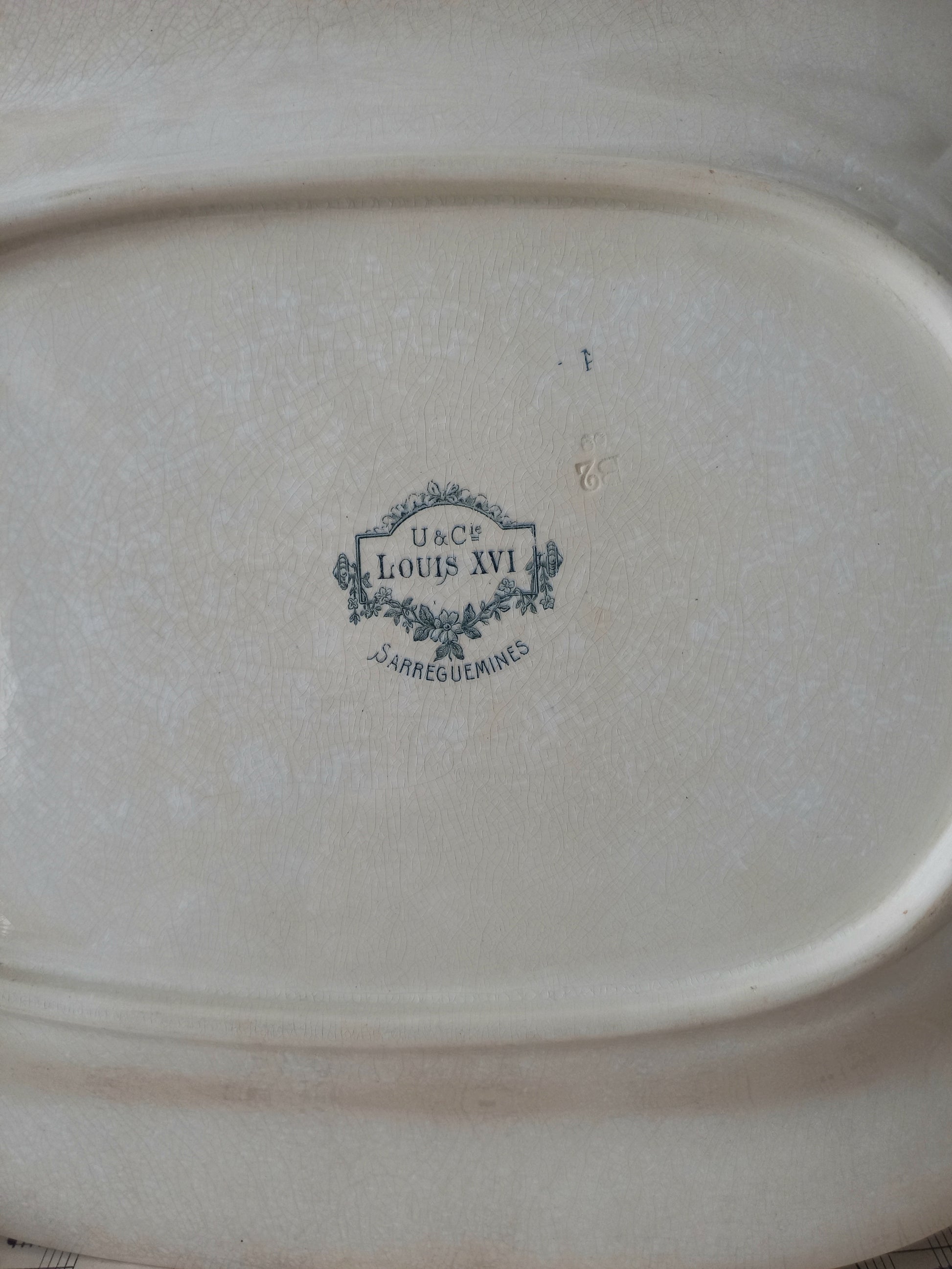 Rear of French antique aged white ironstone plate/platter.