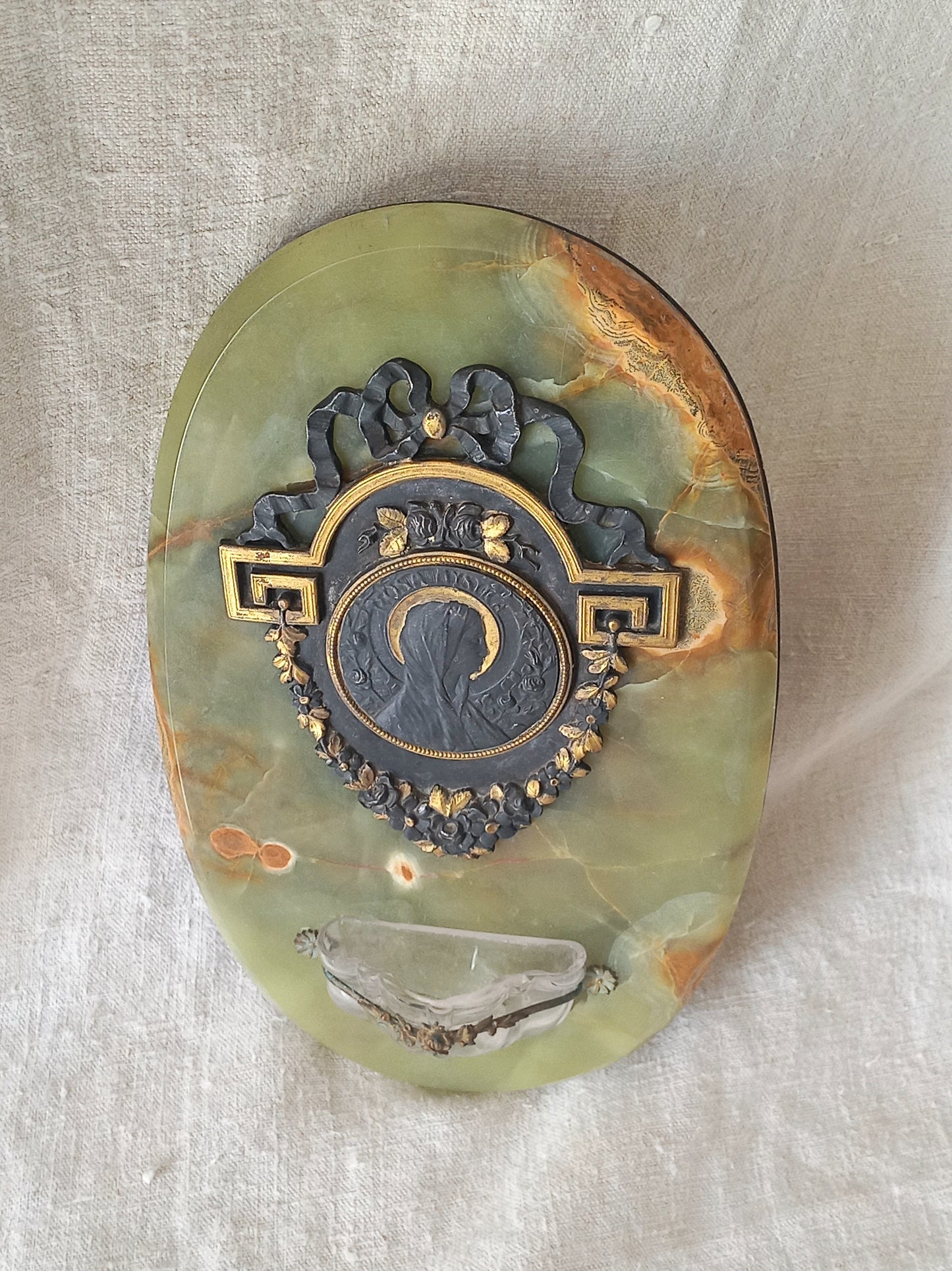 French antique Holy Water font made from onyx with intricate decorative detailing made from metal, a glass water font , and a brass back-plate with a hanging hook