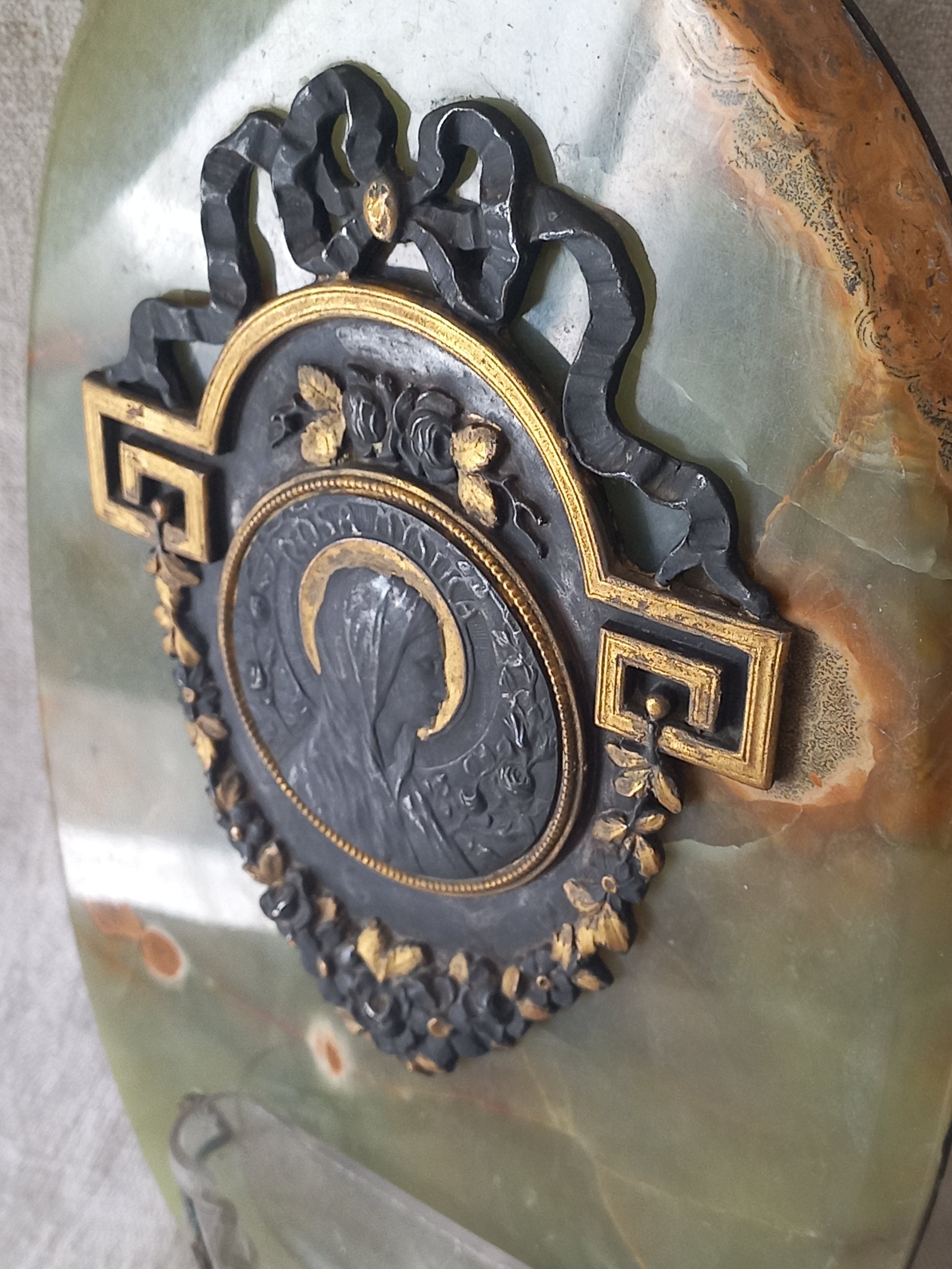 French antique Holy Water font made from onyx with intricate decorative detailing made from metal, a glass water font , and a brass back-plate with a hanging hook.