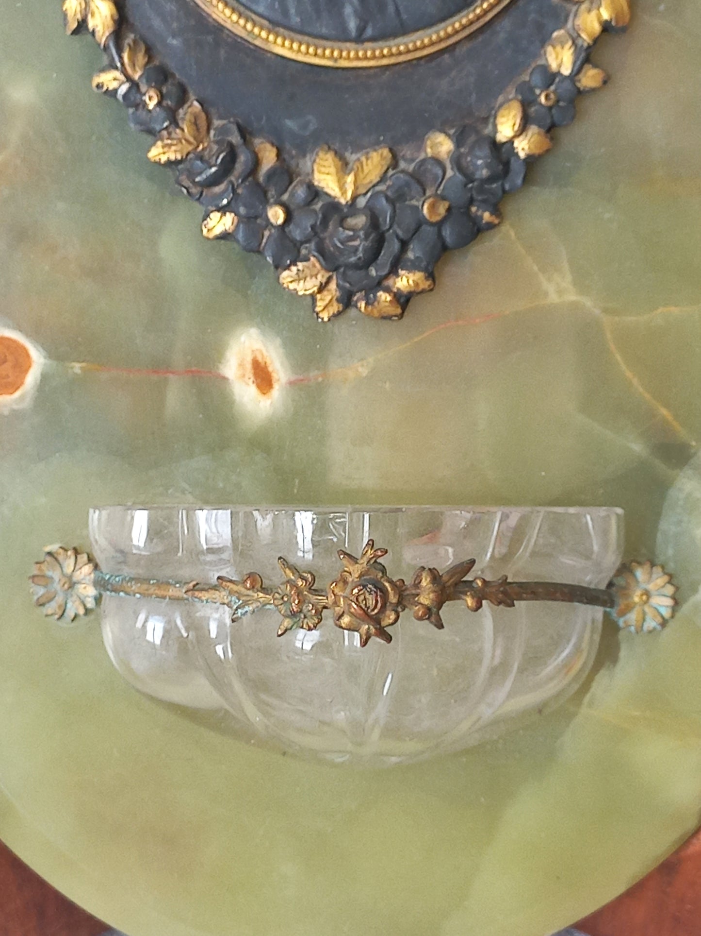 French antique Holy Water font made from onyx with intricate decorative detailing made from metal, a glass water font , and a brass back-plate with a hanging hook.