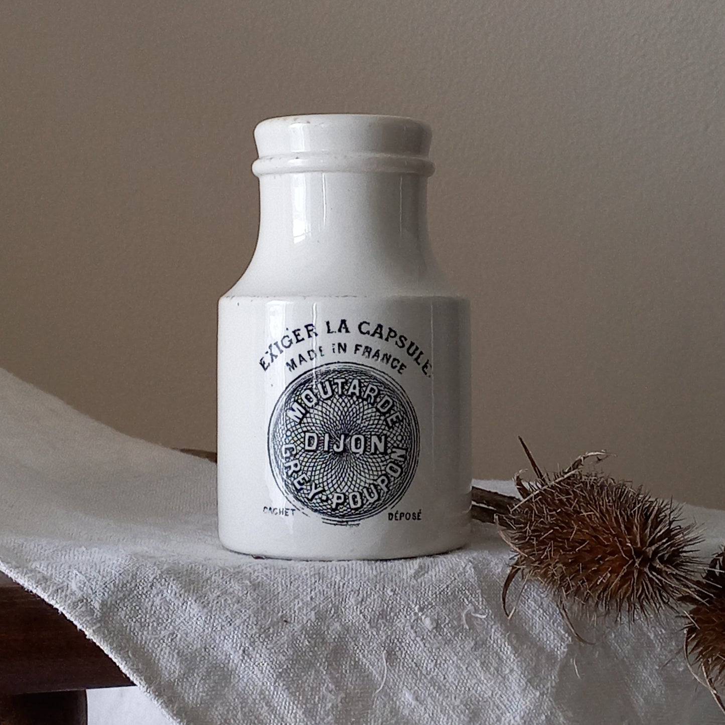 A small antique white ironstone Dijon Grey-Poupon mustard pot made by premier French manufacturer Sarreguemines. These little pots are very collectible and make wonderful pieces of home decor.
