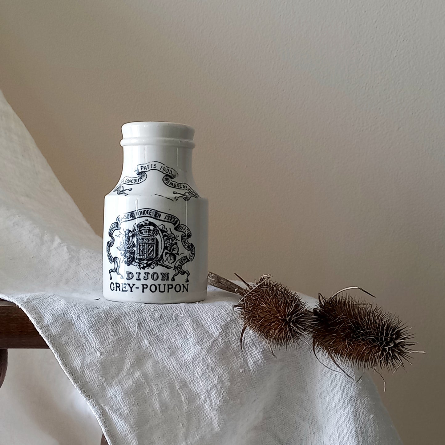 A small antique white ironstone Dijon Grey-Poupon mustard pot made by premier French manufacturer Sarreguemines. These little pots are very collectible and make wonderful pieces of home decor.