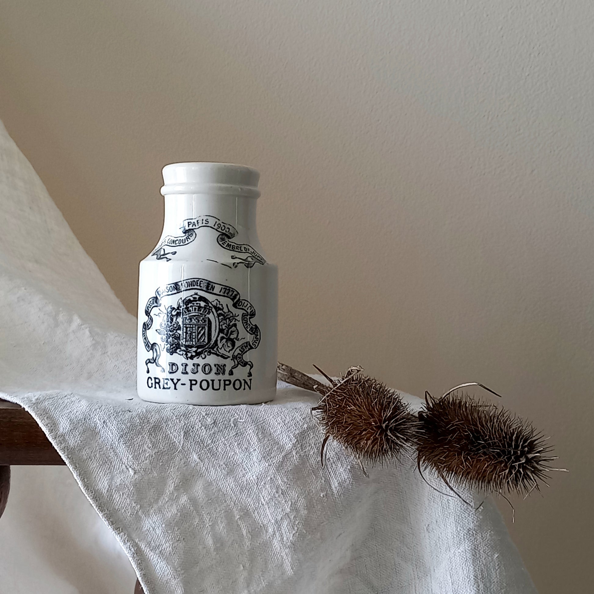 A small antique white ironstone Dijon Grey-Poupon mustard pot made by premier French manufacturer Sarreguemines. These little pots are very collectible and make wonderful pieces of home decor.