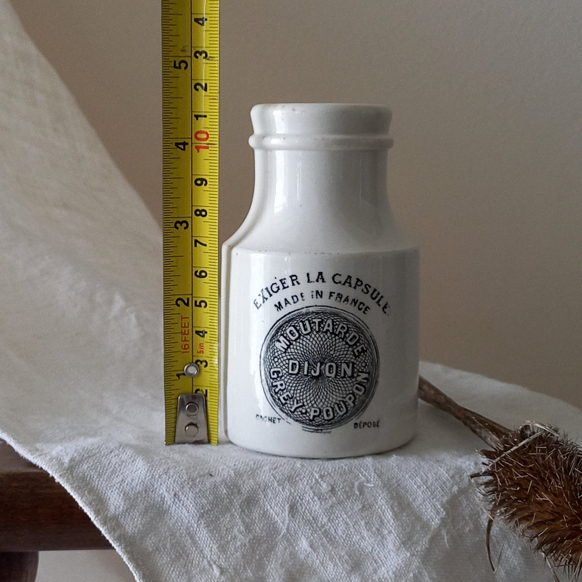 A small antique white ironstone Dijon Grey-Poupon mustard pot made by premier French manufacturer Sarreguemines. These little pots are very collectible and make wonderful pieces of home decor.